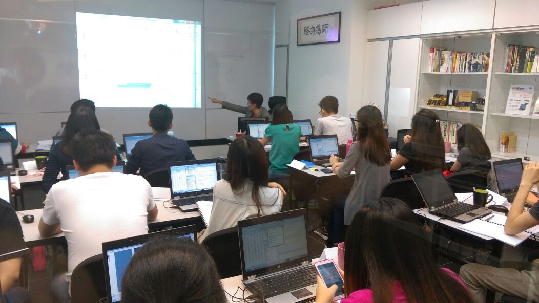 Finance team working through a hands-on data workshop